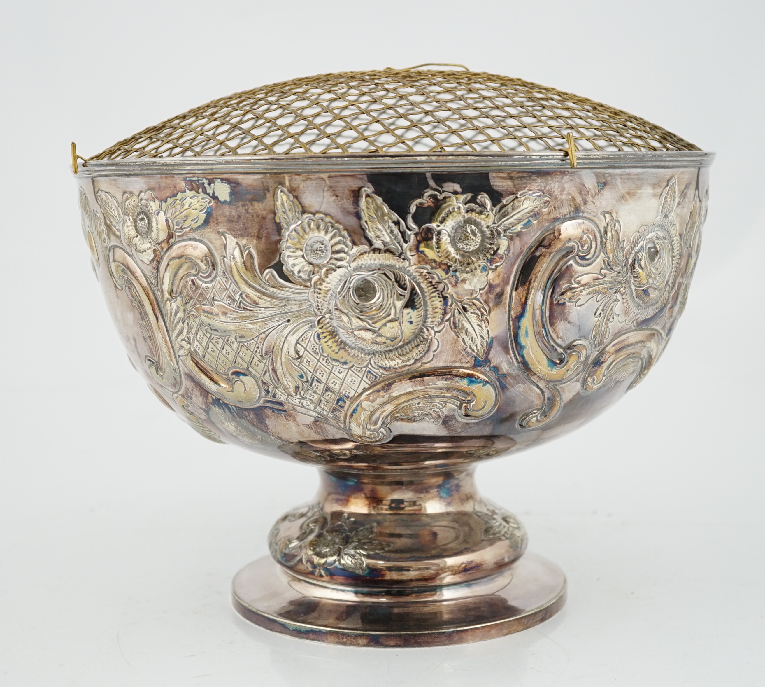 A large Edwardian repousse silver rose bowl, by Carrington & Co